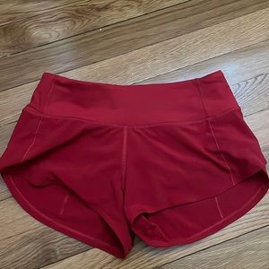 Lululemon size 0, 2.5 inch red speed ups